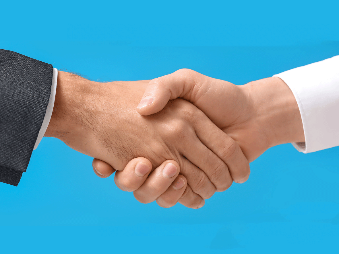 The image depicts a handshake, we can only see the cuffs of their clothing but it appears to be business dress. This image is used to show positive and professional relations between the organisation and employers in Glasgow.